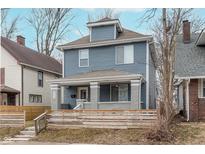 Charming two-story home with blue siding and a welcoming front porch at 3550 N Illinois St, Indianapolis, IN 46208