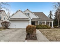 Charming home featuring a well-manicured lawn, attached garage, and a welcoming front porch at 780 Pawtucket Dr, Westfield, IN 46074