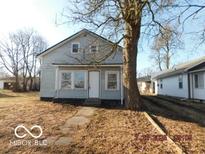 Charming home featuring a front yard with a large tree providing shade at 1311 E Hines St, Muncie, IN 47303