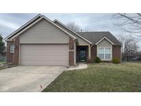 Charming single-Gathering home featuring brick and siding, a two-car garage, and well-maintained lawn and landscaping at 4819 Lakestone Dr, Indianapolis, IN 46237