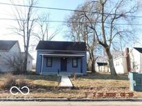 Charming single-Gathering home featuring a cozy front porch and classic architectural details at 711 W Centennial Ave, Muncie, IN 47303