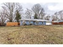 Charming single-story home featuring a well-manicured lawn and brick facade at 7671 Sherry Ln, Brownsburg, IN 46112