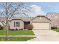 Charming single-story home with a manicured lawn and an attached two-car garage at 11458 Lucky Dan Dr, Noblesville, IN 46060