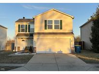 Two-story home featuring green shutters, a spacious two-car garage, and a well-maintained front yard and concrete driveway at 14762 Fawn Hollow Ln, Noblesville, IN 46060