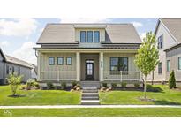 Charming one-story home featuring a welcoming front porch, manicured lawn, and professional landscaping at 17364 Pinellas Ave, Westfield, IN 46074