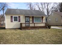 Charming home with a cozy front porch and red shutters at 2261 N Centennial St, Indianapolis, IN 46222