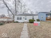 Charming single-story home with a simple facade, small yard, and a 'For Sale' sign displayed prominently at 2959 N Lasalle St, Indianapolis, IN 46218