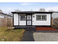 Charming single-story home with a well-maintained front yard and modern black and white trim at 3053 Adams St, Indianapolis, IN 46218