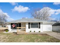 Charming ranch home with white siding, black shutters, and an inviting front porch at 3626 St. Charles St, Anderson, IN 46013