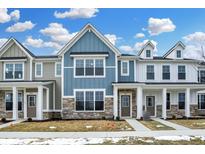 Charming townhomes featuring stone accents and inviting front doors in a vibrant community at 3917 Wren Dr, Brownsburg, IN 46112