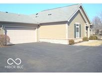 Charming exterior of home with an attached garage and well maintained landscaping at 515 Bridgestone Dr, Mooresville, IN 46158