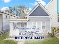 Charming single-Gathering home featuring a well-maintained front yard and classic architectural details at 1210 S State Ave, Indianapolis, IN 46203