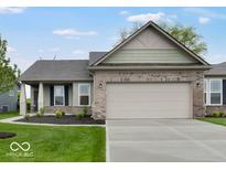 Charming single-story home with a two-car garage, well-manicured lawn, and brick accents at 275 Hunters Ridge Dr, Danville, IN 46122