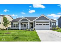 Charming single Gathering home with stone accents, manicured lawn, and a two car garage at 3687 Thomas Jefferson Ct, Westfield, IN 46074