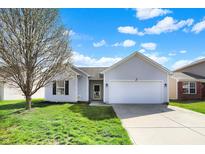 Charming single-story home with a well-maintained lawn and attached two-car garage at 4051 Presidio Cir, Indianapolis, IN 46235