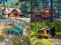 Rustic cabin exterior featuring a cozy front porch surrounded by lush greenery at 7116 Grandview Rd, Columbus, IN 47201