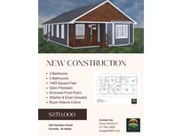 Charming new construction features a covered porch, gray siding and appealing architectural details at 306 Hamilton St, Fortville, IN 46040