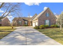 Charming brick home with an attached garage and a well-manicured lawn at 3520 Inverness Blvd, Carmel, IN 46032