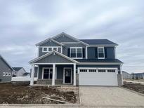 Charming two-story home featuring a two-car garage and covered front porch at 3667 Thomas Jefferson St, Westfield, IN 46074
