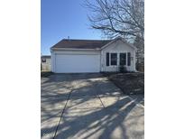 Charming home featuring a two-car garage, well-maintained lawn, and inviting curb appeal at 10793 Walnut Grove Bnd, Camby, IN 46113