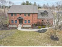Charming two-story brick home with a landscaped yard, walkway and covered entryway, showcasing curb appeal at 1622 E Mohr Rd, Greenfield, IN 46140