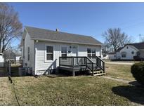 Charming single-Gathering home featuring a welcoming front porch and well-maintained lawn under a clear blue sky at 2105 N Cherry St, Columbus, IN 47201