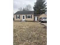 Charming single-story home with classic black shutters and a well-manicured front yard at 8833 Crawfordsville Rd, Indianapolis, IN 46234