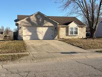 Charming single Gathering home with a two car garage and a well maintained lawn at 102 Azalea Dr, Mooresville, IN 46158