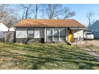 Charming single-story home featuring a new roof, bright yellow door, and well-maintained front yard at 1459 E Lynn Dr, Indianapolis, IN 46202