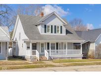 Charming two-story home with a welcoming porch and classic architectural details at 1714 Elm St, Columbus, IN 47201