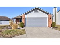 Single Gathering home with a two car garage, and beautiful landscaping at 4042 Eagle Cove East Dr, Indianapolis, IN 46254