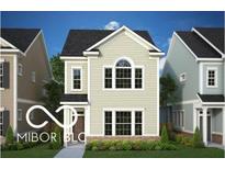 Charming two-story home with light beige siding, black roof, and a well-manicured front lawn and landscaping at 737 Madelyn Dr, Carmel, IN 46032