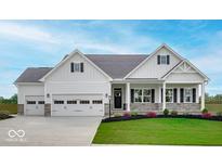 Charming exterior of a two-story home with a manicured lawn, covered porch and multi-car garage at 7707 Walker Dr, Avon, IN 46123