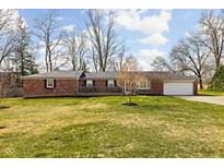 Charming brick ranch home with a well-manicured lawn and inviting front porch at 7795 E 160Th St, Noblesville, IN 46062