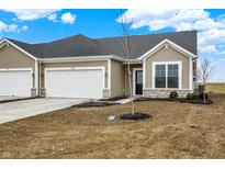 Charming single Gathering house featuring an attached garage and a well-maintained lawn at 1609 Clover Crossing Dr, Greenfield, IN 46140