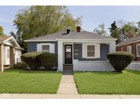 Charming home with blue siding, white trim, and manicured lawn at 1817 Medford Ave, Indianapolis, IN 46222