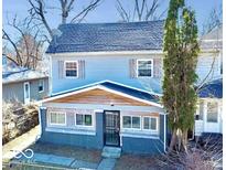 Charming two-story home featuring light blue siding, wood accents, and well-maintained landscaping at 2839 E 19Th St, Indianapolis, IN 46218