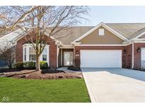 Charming single-story home features a manicured lawn, brick facade, and attached two-car garage at 3509 Heathcliff Ct, Westfield, IN 46074