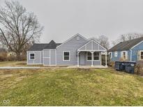 Charming single-story home with gray siding, a covered porch, and a well-maintained lawn at 3918 Columbus Ave, Anderson, IN 46013