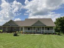 Charming single-story home featuring a welcoming front porch, well-maintained lawn, and tasteful landscaping at 1002 Plummer Rd, Martinsville, IN 46151