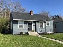 Charming home with a gray exterior, dark roof, tidy landscaping, and inviting front entrance at 1953 N Linwood Ave, Indianapolis, IN 46218