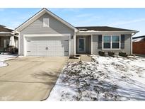 Charming one-story home featuring a two-car garage and landscaped front yard at 2525 Bridlewood Dr, Franklin, IN 46131