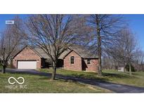 Charming one-story brick home with a well-manicured lawn and an attached two-car garage at 2731 Trailridge Ct, Martinsville, IN 46151