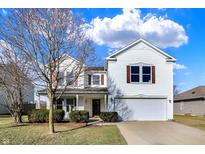 Charming two-story home with white siding, a well-maintained lawn, and a two-car garage at 5622 Skipping Stone Dr, Indianapolis, IN 46237