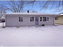 Charming single-story home featuring a classic facade, snow-covered yard, and welcoming entryway at 639 S Alpha Ave, Brownsburg, IN 46112