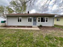 Charming single-story home with grey siding, a red roof, and a well-kept front lawn at 639 S Alpha Ave, Brownsburg, IN 46112