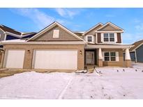 Charming two-story brick home with a two-car garage, complemented by a well-maintained lawn and inviting curb appeal at 6812 W Wintergreen Ct, McCordsville, IN 46055