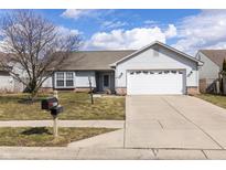 Charming single-story home with a well-maintained lawn and attached two-car garage at 8417 Southern Springs Way, Indianapolis, IN 46237