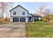 Charming two-story home with a two-car garage, stone accents, and well-maintained lawn at 101 Westminster Dr, Noblesville, IN 46060