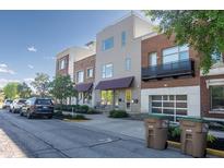 Street view of modern townhomes with brick and stucco exteriors and well-maintained landscaping at 1014 Jackson St, Columbus, IN 47201